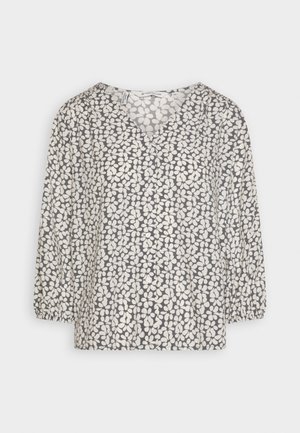 Natisnjena bluzka z sivo ozadjem in belimi listnatimi vzorci, z V-izrezom in tričetrtnimi rokavi z elastičnimi manšetami. Mehka, lahko tkanina.