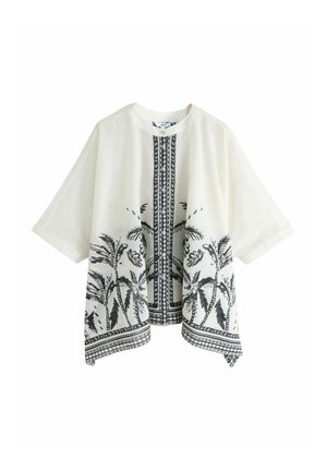 Witte blouse met korte mouwen met een zwarte palmboomprint langs de onderkant en een verticale gestreepte baan in het midden voor.