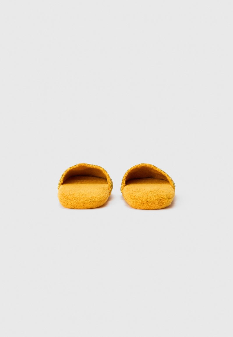 Pair of soft, orange open-toe slippers with a textured fabric, placed side by side on a plain white background.