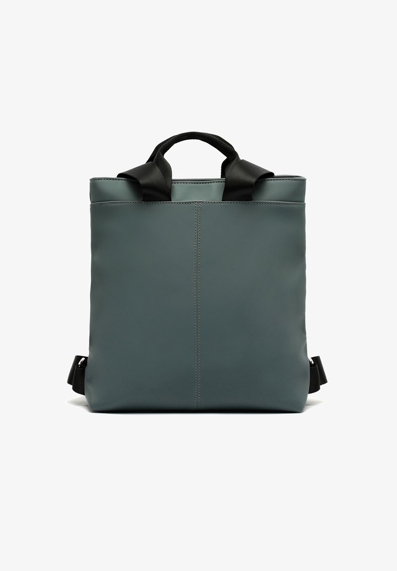 Nahrbtnik izdelan iz gladkega, temno zelenega materiala s strukturirano zasnovo, z dvema črnima ročajema in nastavljivima naramnicama.