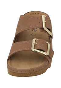 Brown leather sandal with two adjustable straps, gold-tone buckles, and a textured cork sole. Soft interior lining visible.
