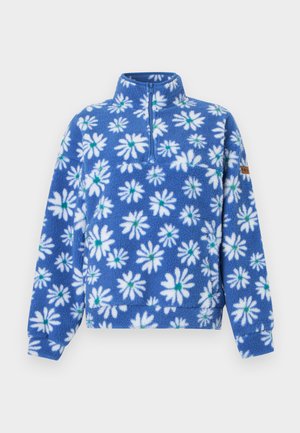 Kék polár pulóver fehér margaréta mintákkal, hosszú ujjú, fél cipzáras elejű és magas nyakú.