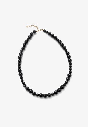 Collier noir à perles graduées rondes avec fermoir à chaîne réglable doré sur fond blanc.