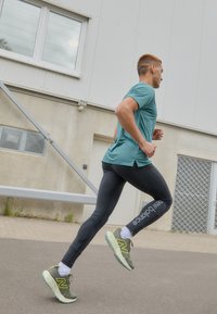 New Balance SLEEK REFLECIVE TIGHT - Leggings - black