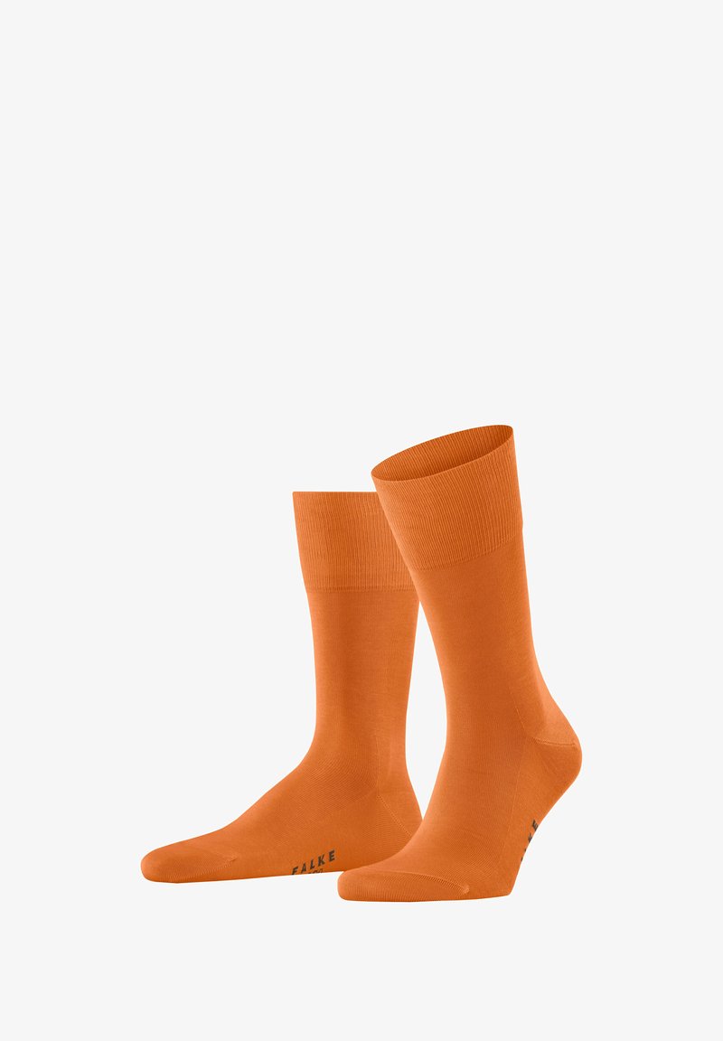 Orangene Baumwollsocken mit geripptem Bündchen, glatter Textur und verstärktem Zehen- und Fersenbereich. Markenlogo auf der Sohle gedruckt.