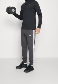 adidas Sportswear Träningsbyxor - grey
