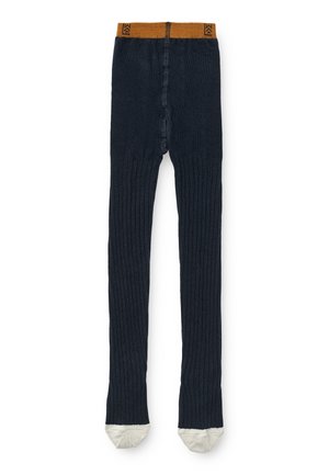 Collants côtelés navy avec une taille en moutarde et des pieds de couleur crème. Présente un ajustement serré et un tissu texturé.