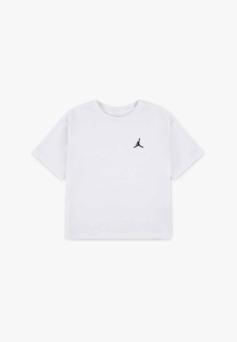 T-shirt en coton blanc avec un logo Jumpman noir sur le côté gauche de la poitrine, manches courtes et col rond classique.