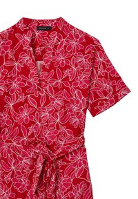 Red floral wrap dress with short sleeves, featuring white outlined floral patterns, a v-neckline, and a tied waist detail.