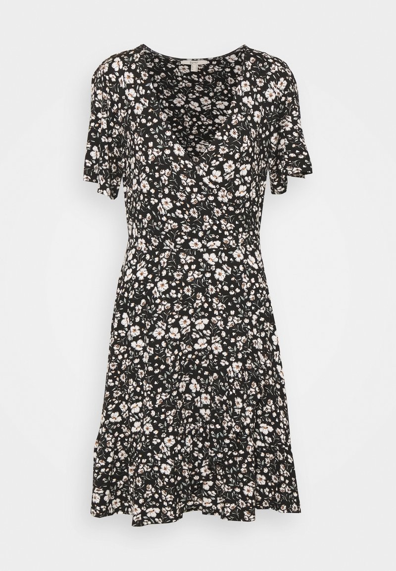 Robe noire à manches courtes avec imprimé floral blanc, col en V et jupe évasée, conçue pour une coupe décontractée.