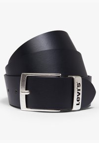 Black leather belt with a silver metal buckle. Features a logo stamped on the buckle. Smooth texture and classic design.