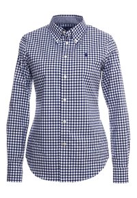 Mörkblå och vit rutor skjorta med knapp-down krage, långa ärmar och rundad nederkant. Den har en liten broderad logo på bröstet.