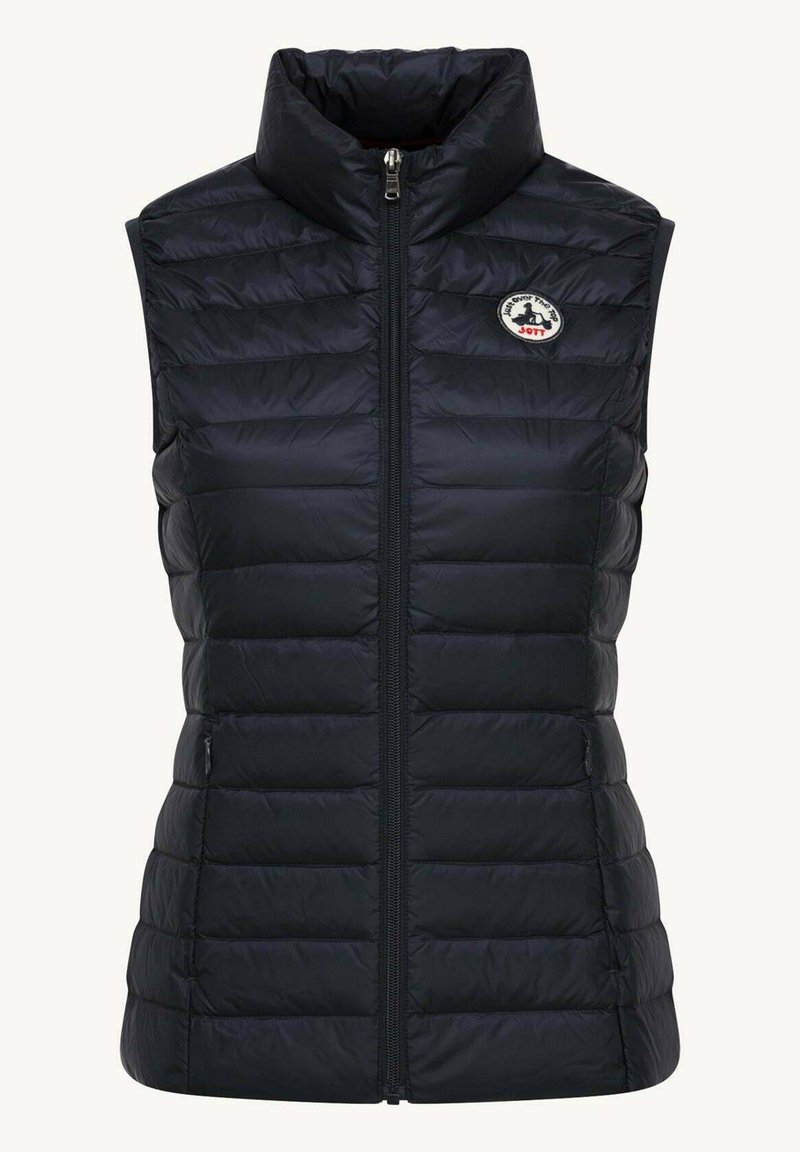 Gilet imbottito nero con colletto alto, chiusura con zip frontale e motivo trapuntato orizzontale; presenta una toppa rotonda con logo nella zona sinistra del petto.