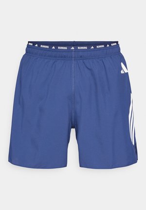 Blå løpeshorts med elastisk midjebånd, med hvite logoaksenter og sidesliss for fleksibilitet. Laget av lett stoff.