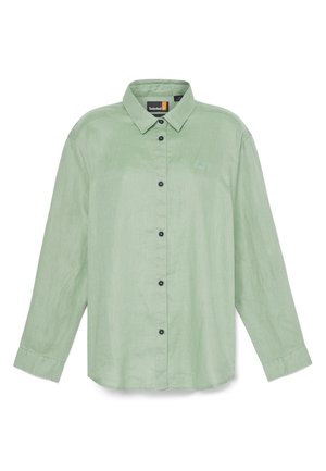 Camicia a maniche lunghe verde chiaro con colletto a bottone, bottoni frontali e piccolo ricamo del logo. Realizzata in un tessuto strutturato.