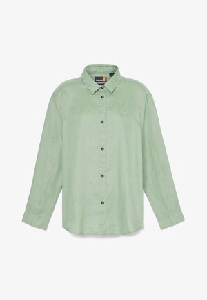 Lys grøn langærmet skjorte med button-down krave, forreste knapper og en lille broderet logo. Lavet af et struktureret stof.