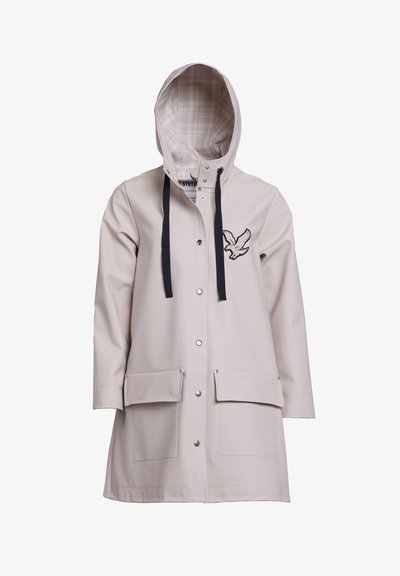 Light beige raincoat made of waterproof material, featuring a plaid-lined hood, snap buttons, two front pockets, and an embroidered bird design.