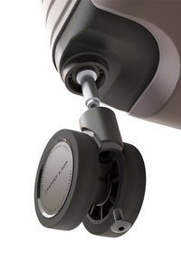Grijze wieltjesattachament met een glad, rond zwart rubberen wiel, metalen as en plastic omhulsel met zichtbare merkgravure.