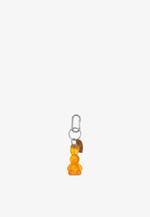 Pequeño llavero translúcido naranja en forma de conejito con ojos redondos, anillo de metal y mosquetón.