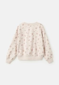 Bež sweatshirt s svetlo rjavimi nepravilnimi leopardjimi pikami, z dolgimi rokavi ter rebrastimi manšetami in robom.