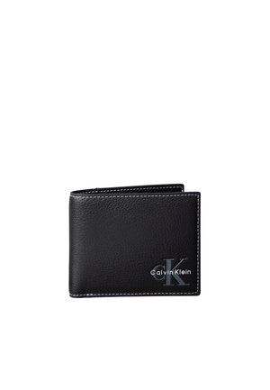 Sort læder pung fra Calvin Klein med hvide syninger og præget logo nederst i højre hjørne på hvid baggrund.