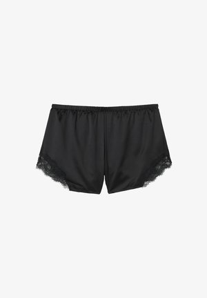 Shorts en satin noir avec une taille élastique, ornés de délicates bordures en dentelle noire le long de l' ourlet pour plus de détails et de texture.