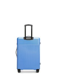 Harde blauwe koffer met verticale ribbelstructuur, zwarte telescopische handgreep en vier soepel rollende wielen voor mobiliteit.