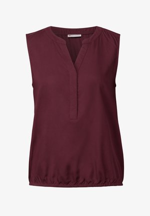 Burgundy ärmellös blus med v-ringning, rynkade axlar och elastisk nederkant, tillverkad av mjukt tyg. Enkel, ren design.