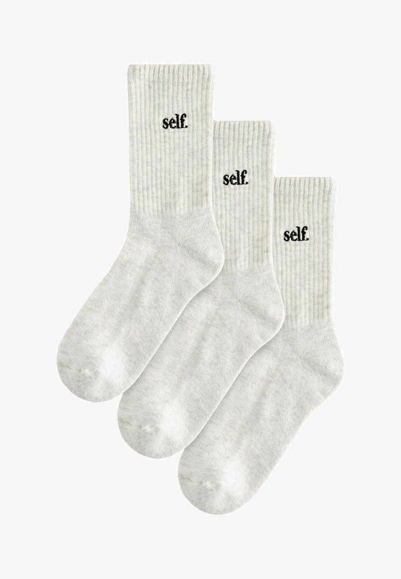 Gray cotton socks with ribbed texture, featuring the word "self." embroidered in black, in a set of three.