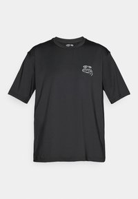 Black short-sleeve athletic t-shirt with small perforations on sides and “KARMA” text and eye graphic on left chest.
