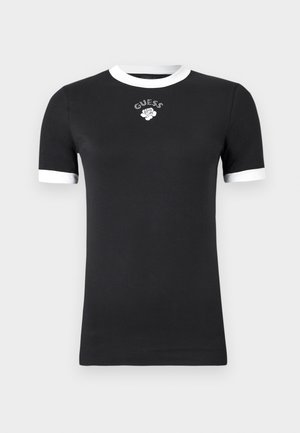 Must särkjärk mustade lühikeste varrukatega, millel on valged krae ja mansetid, ning rinnal valge roos ja "GUESS" tekst väikeste rhinestone'idega.