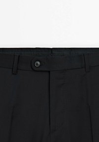 Black trousers made of smooth fabric, featuring a single button closure, belt loops, and neat stitching. Front pockets are also visible.