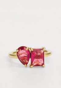 Gold ring featuring two pink gemstones: one pear-shaped and one rectangular, both with faceted surfaces and prong settings.