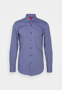 Camicia con bottoni, a quadretti blu e bianchi, maniche lunghe, colletto e bottoni neri. Realizzata in un tessuto leggero.