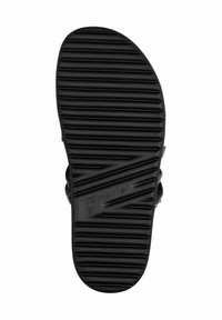 Black rubber sandal sole with horizontal grooves, featuring brand name "Tamaris" and size "37" embossed. Smooth texture with a rounded shape.