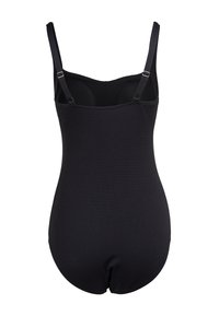 Maillot de bain une pièce noir texturé avec des bretelles réglables et une coupe ajustée. Doté de bonnets sans coutures et d'un dos lisse.