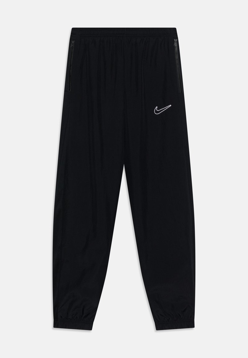 Pantalones deportivos negros con cinturilla elástica, diseño de pierna ajustada, bolsillos laterales con cierre y el logo blanco de Nike en el muslo izquierdo.