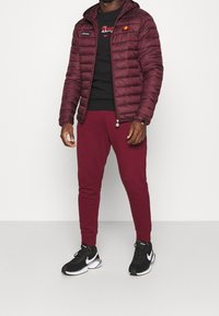 Ellesse Übergangsjacke - dark red