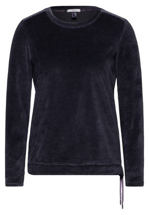 Chemise à manches longues bleu marine foncé en tissu doux et texturé. Présente un col rond et un ourlet ajustable avec des cordons violets de chaque côté.