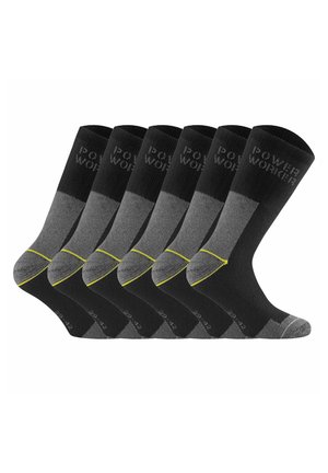 Sechs Paare schwarze und graue Crew-Socken mit gelben Akzenten und dem Schriftzug "POWER WORKER" am Bündchen, nebeneinander dargestellt.