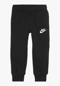Pantalones de chándal negros de Nike con un cinturón elástico, piernas ajustadas y acento de logo blanco. Fabricados en una suave mezcla de algodón elástico.