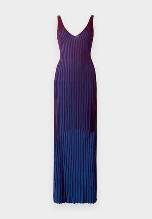 Long, body-hugging dress with deep V-neck, featuring vertical stripes in gradient shades of maroon and blue, made from a smooth, stretchy fabric.