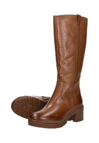 Bruine leren kniehoge laarzen met een ronde neus, een lage blokhak en een gestructureerde bovenkant. Voorzien van stikseldetails en een rubberen zool.
