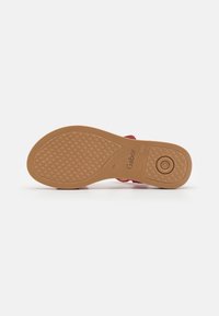 Gabor sandal sole, featuring a textured brown rubber, a circular detail, and pyramidal grip pattern for traction. Color: light brown.