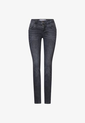 Schlanke Jeans aus dunklem Denim mit hoher Taille, zwei Fronttaschen und doppeltem Knopfverschluss. Dezente Verwaschungen und Nähedetails sind sichtbar.