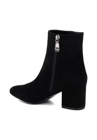 Black suede ankle boot with a pointed toe, side zipper, and a chunky heel. Features a smooth texture and minimalist design.