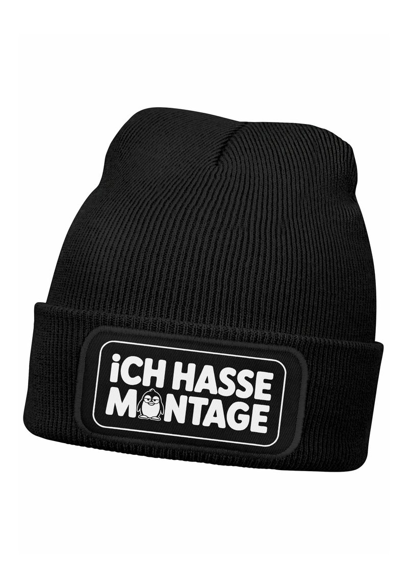 Black knitted beanie with a cuff and a rectangular patch featuring the text “¡ICH HASSE MONTAGE!” in white and a cartoon penguin graphic.
