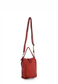 Red leather crossbody bag with a textured finish, featuring a single strap, brass hardware, and a flap closure. Compact square shape.