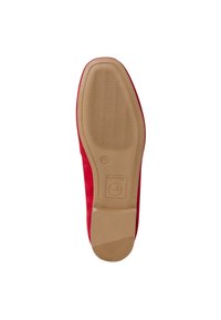 Red suede shoe with a smooth, curved design and a tan rubber sole featuring horizontal lines for traction. Logo embossed on the sole.