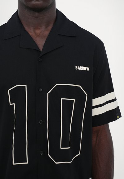 Black short-sleeve button-up shirt featuring a large white outline number "10" on the front, with "BARROW" logo in white on the chest.